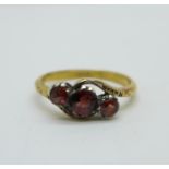 A 9ct gold and garnet ring, 2.1g, M