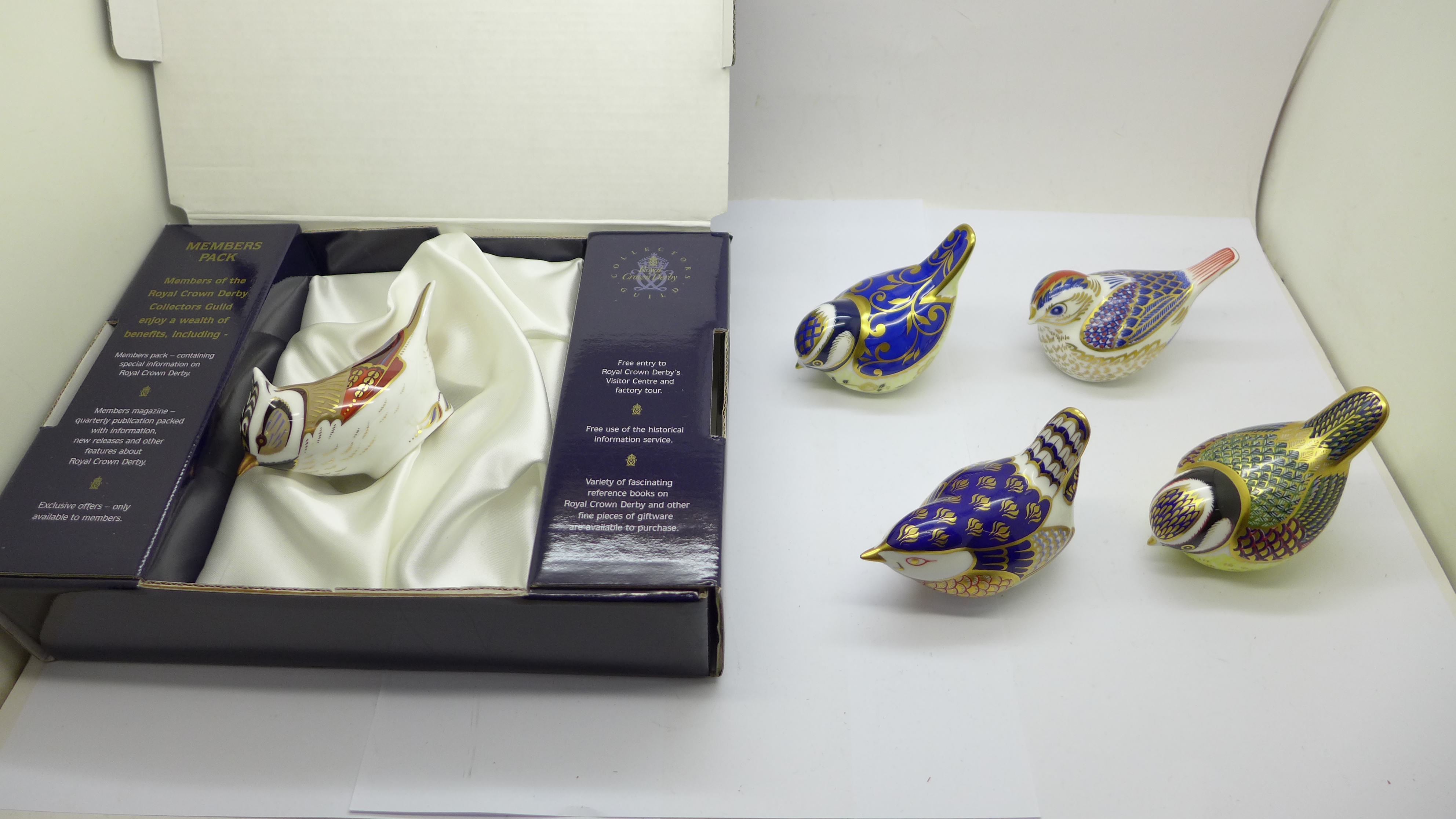 Five Royal Crown Derby paperweights - Goldcrest with gold stopper, Wren with gold stopper, Blue