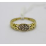A 9ct gold and diamond ring, 1.2g, size O