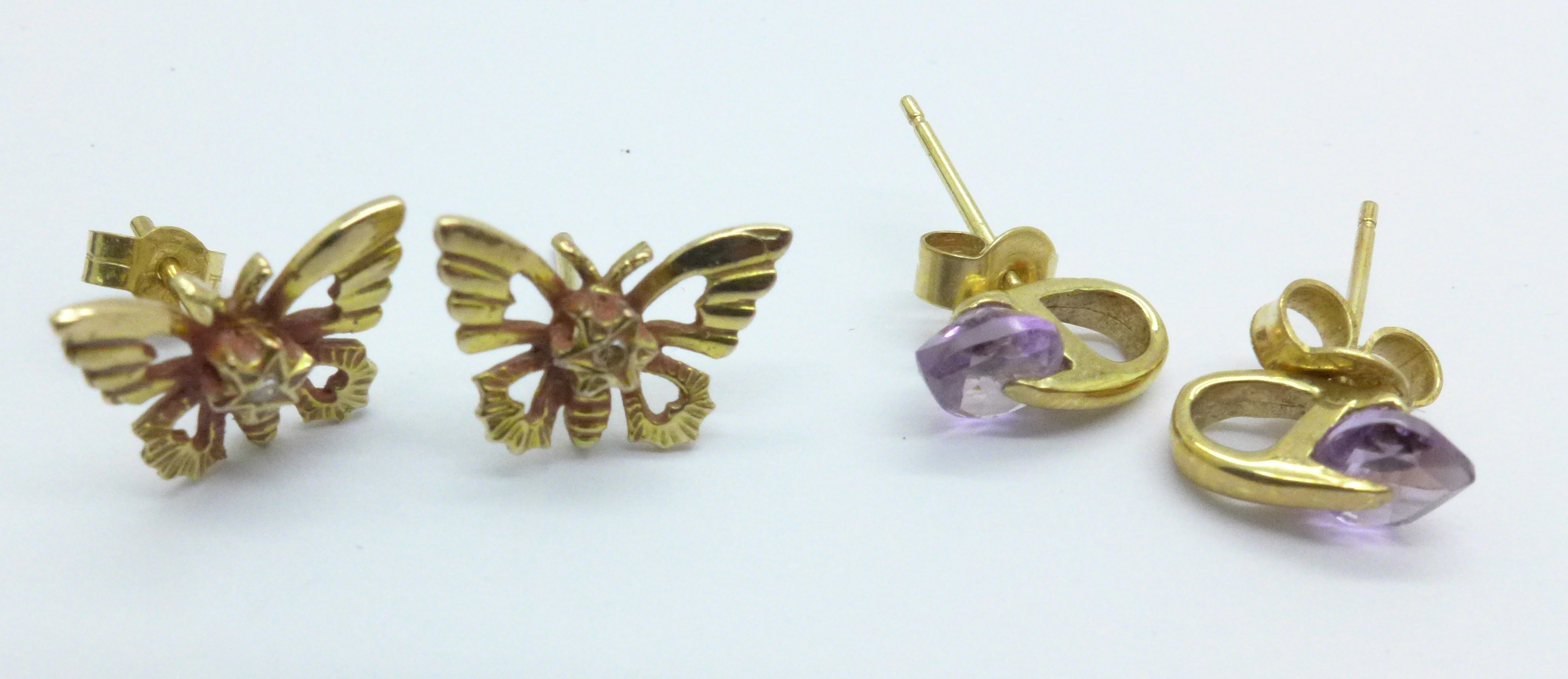A pair of 9ct gold earrings and one other pair, 2.0g