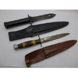 A sawback dagger with leather scabbard and a scout knife with leather scabbard