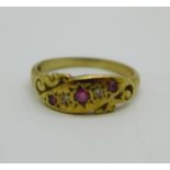 An Edwardian 9ct gold, ruby and diamond ring, M