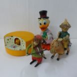 A clockwork monkey violin player and other vintage toys