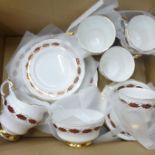 A Paragon Elegance tea service comprising six cups, saucers, side plates and one bread and butter