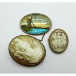 A silver butterfly wing brooch and two cameo brooches