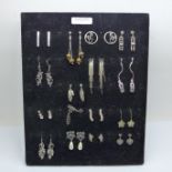 A display tray of silver earrings