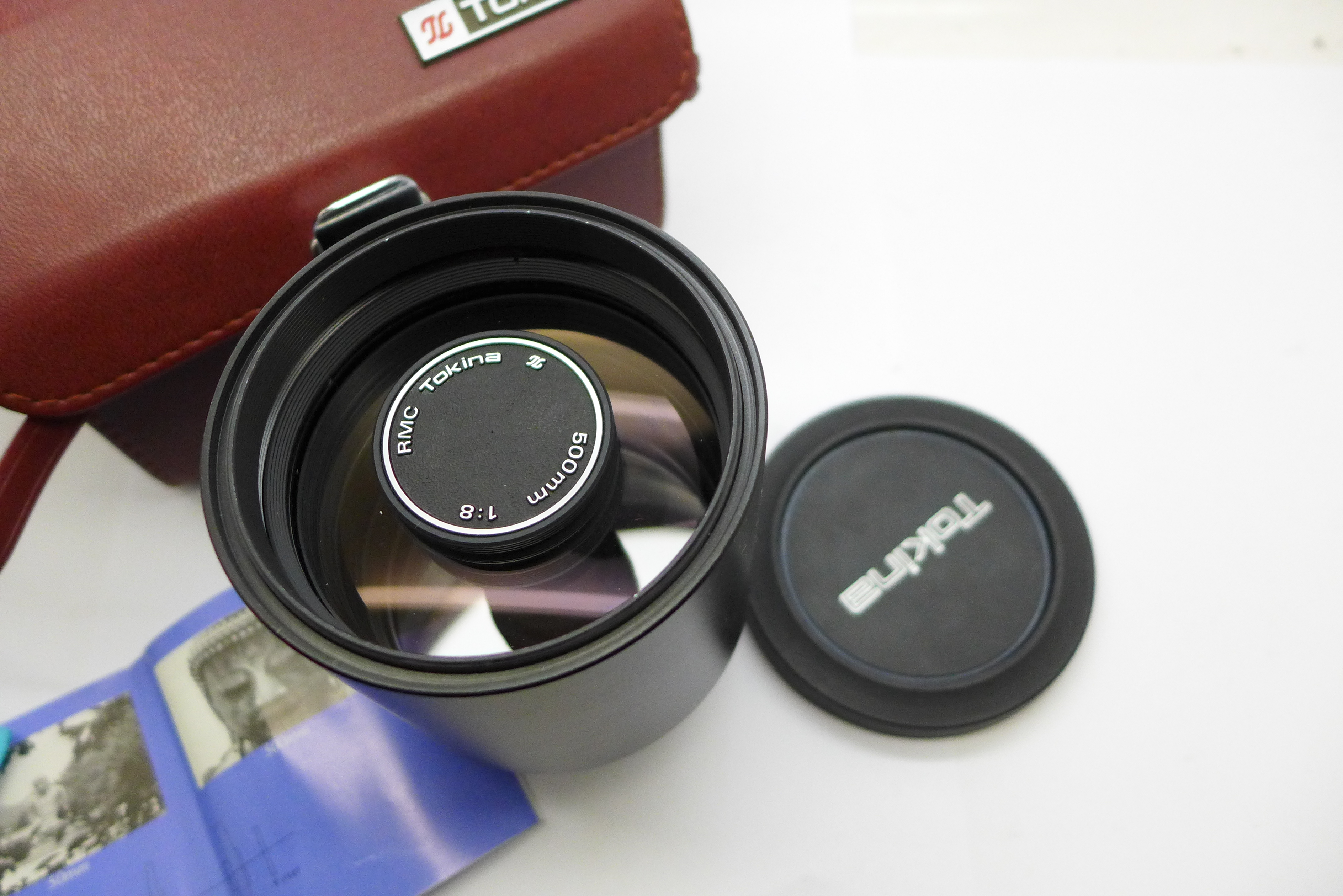 An Olympus f1:8 500mm PK Mount Tokina lens, Tokina caps hood case, three filters and booklets - Image 4 of 4