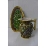 A majolica jug and leaf shaped dish, jug a/f, (hairline)