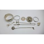 Silver jewellery including a Scottish brooch and a locket with gold applied decoration, 120g
