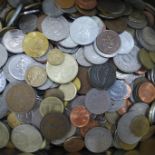 A tin of foreign coins