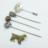 An enamel dog stickpin and three others, and a signed dog brooch