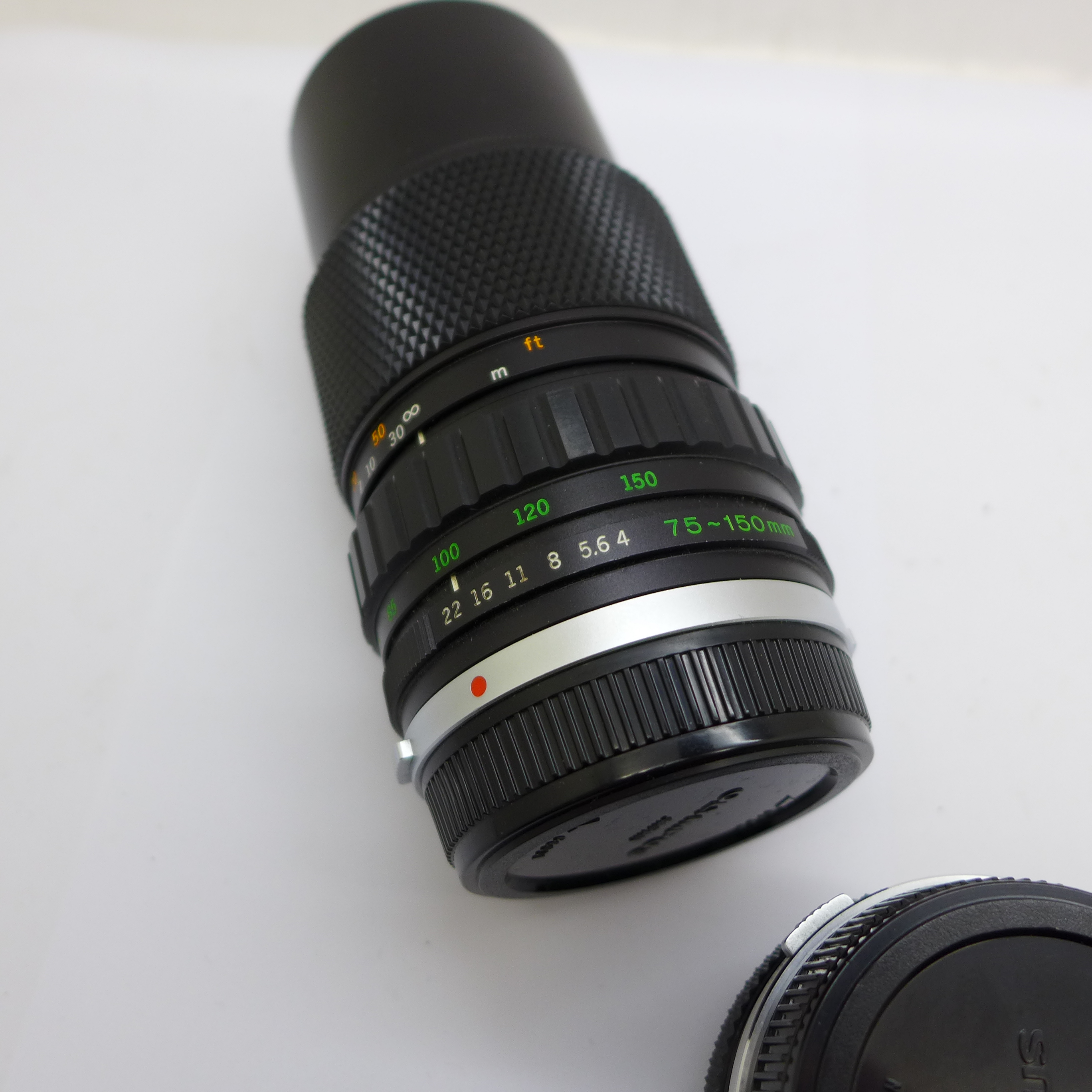 An Olympus f4 75-100mm and Zuiko Olympus f1.8 50mm Zuiko lenses, with caps - Image 4 of 5