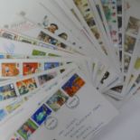 A collection of stamp First Day Covers and commemoratives including higher values and one £10,