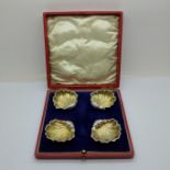 A cased set of four silver shell shaped salts, Birmingham 1904, 37g