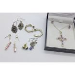 Five pairs of silver earrings and two pendants and chains