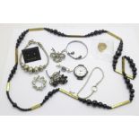 A 9ct gold back and front locket and chain, a silver bracelet, a silver watch and other jewellery