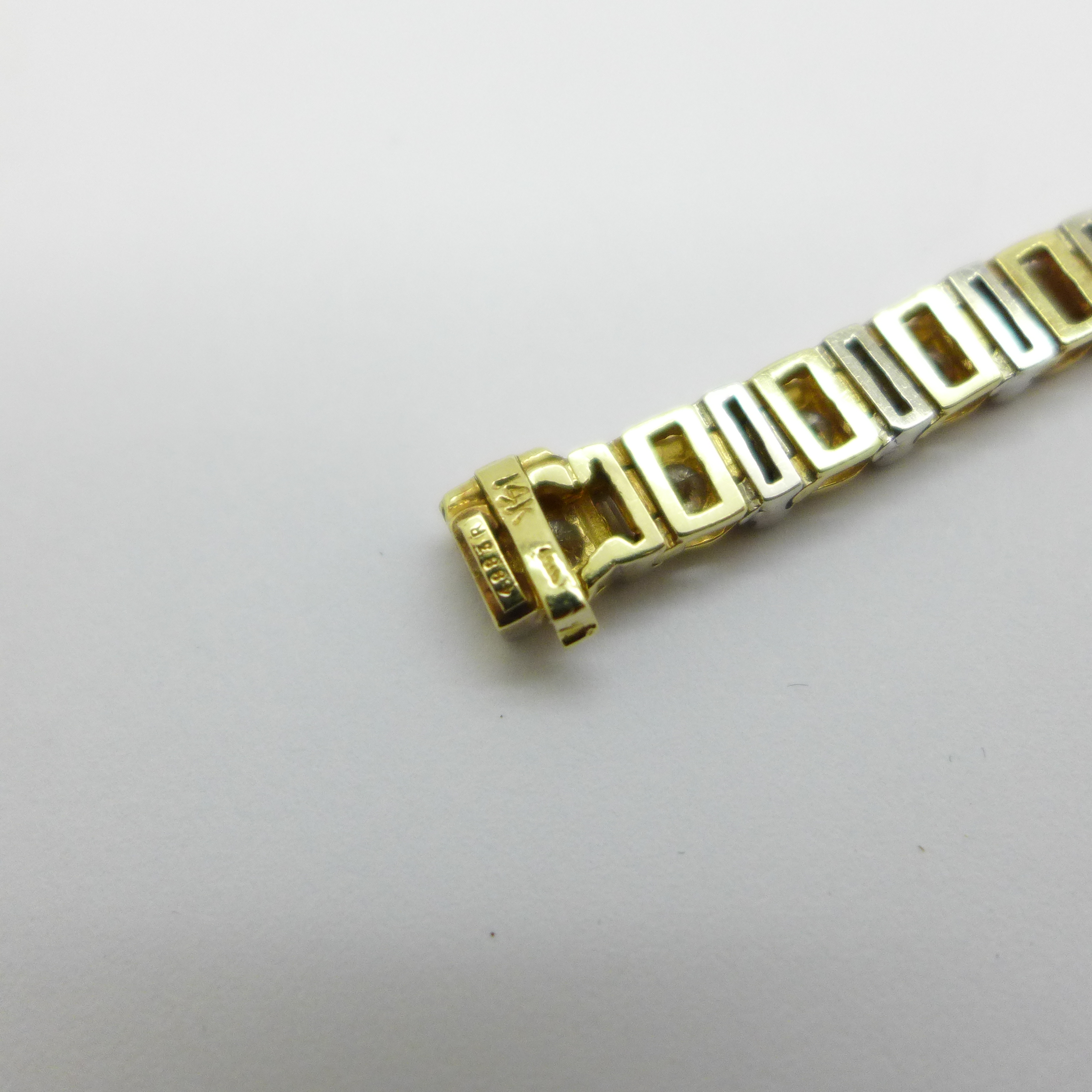 A 14k gold and diamond tennis bracelet with sixty diamonds, approximately 7ct diamond weight, 21.4g - Image 6 of 6