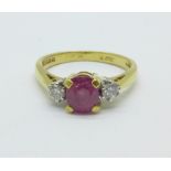 An 18ct ruby and diamond three stone ring, marked 18., 3.6g, M