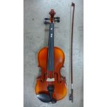 A student's violin and bow, cased