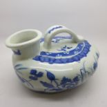 A Chinese blue and white chamber pot