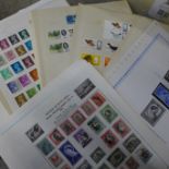 A collection of stamp presentation packs (no stamps), loose stamps, presentation sleeves and