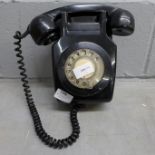 A wall mounted telephone