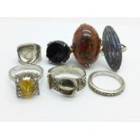 Seven silver rings, amber, etc.