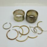 Scrap 9ct gold earrings, 4.6g and two silver napkin rings, 54g