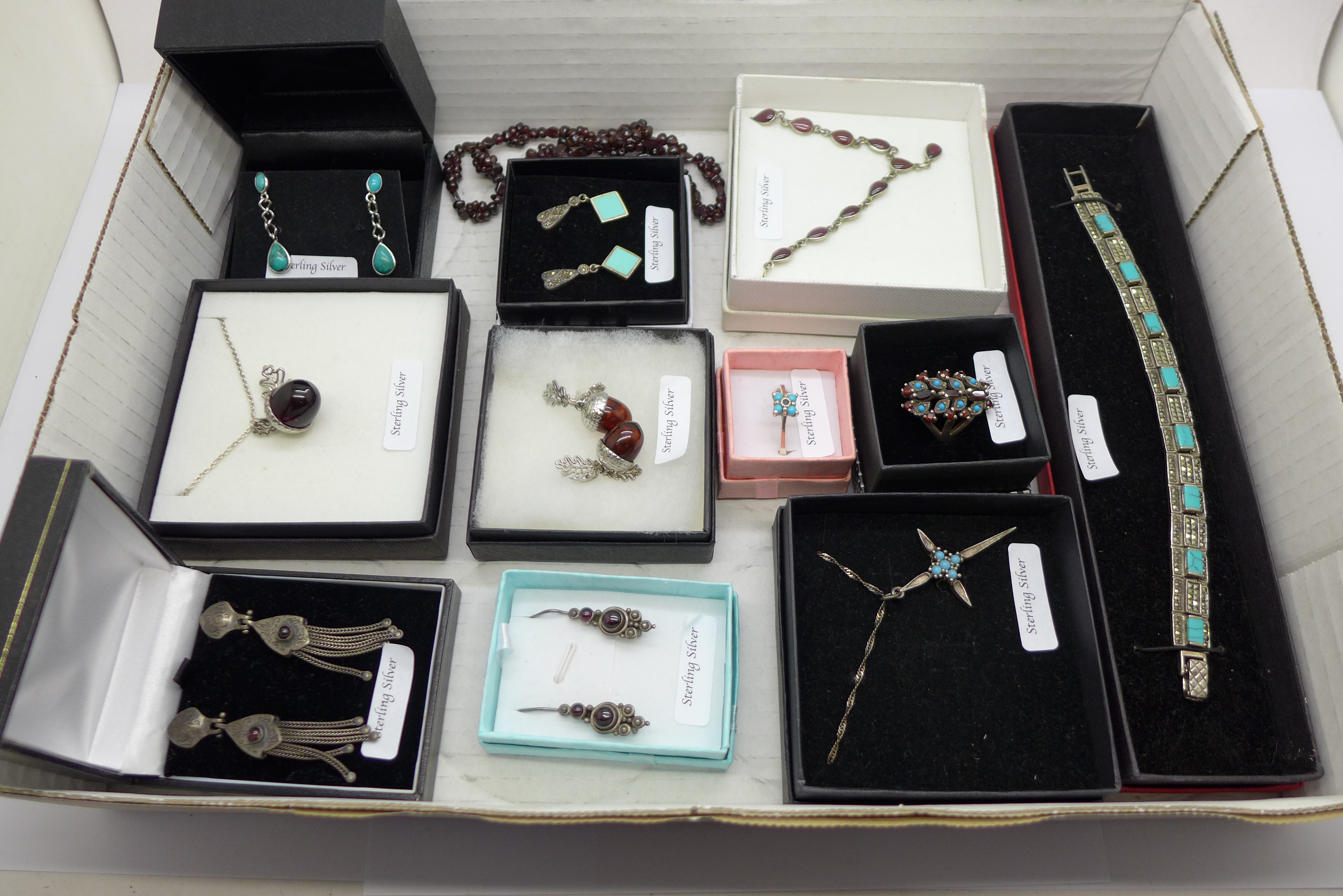 A collection of silver and silver mounted jewellery including turquoise and garnet