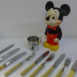 Assorted items including flatware, Mickey Mouse squeaky toy, a pewter Christening mug, etc.
