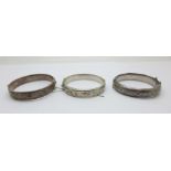 Three silver bangles, 61g