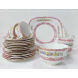 A Staffordshire fine bone china set comprising five cups, seven plates, a milk jug, seven saucers, a