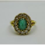 An 18ct gold, twelve stone diamond and emerald ring, 5.3g, P