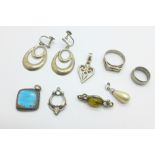 Four silver pendants, an amber brooch, two rings and a pair of silver earrings