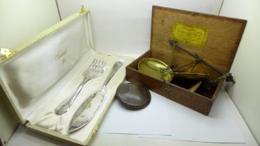 A Christofle serving set, a set of scales, boxed and a leather coin holder