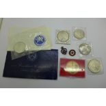 A collection of silver coins, silver dollars (5), a medallion and two enamel badges