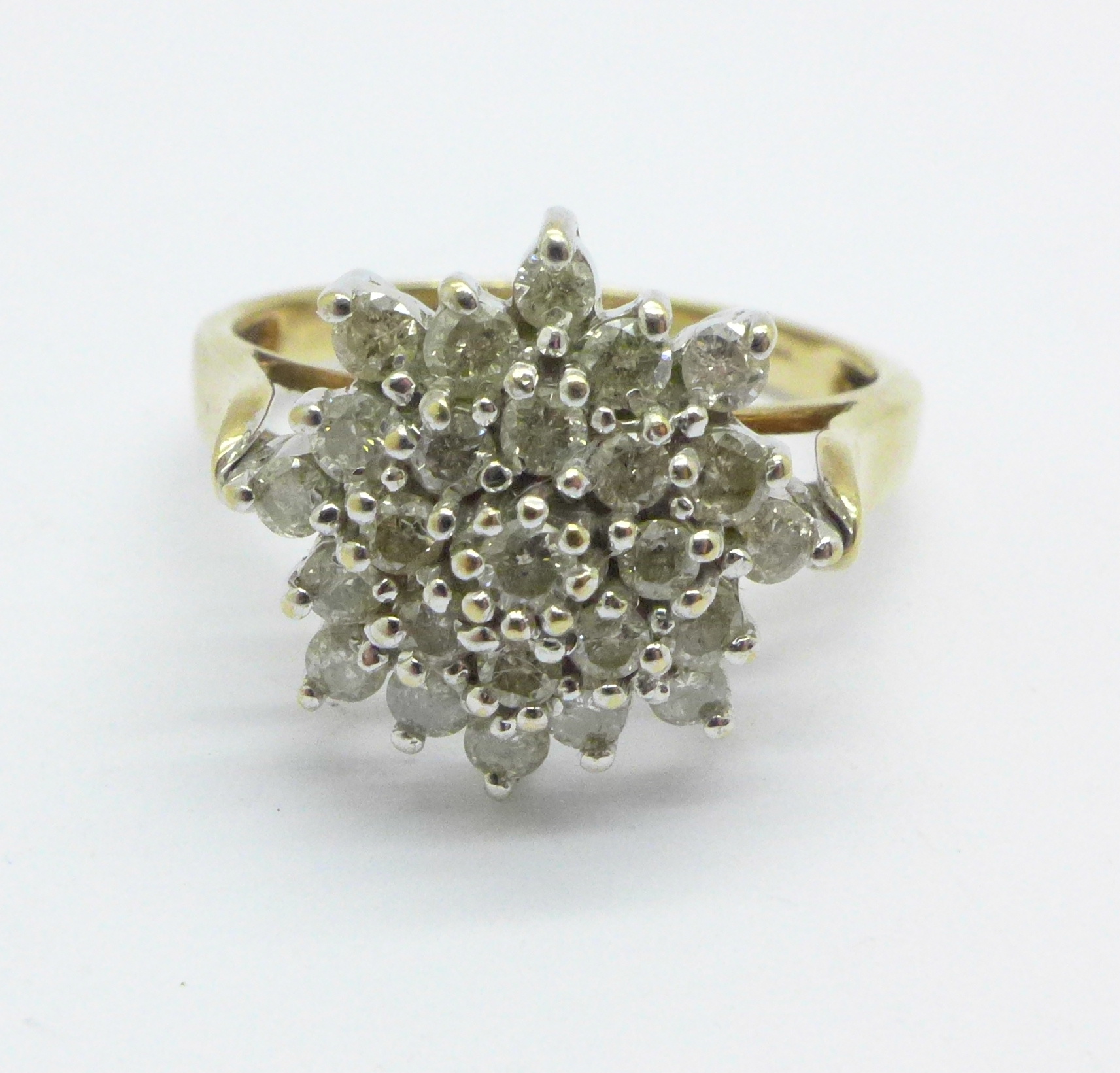 A 9ct gold diamond cluster ring, approximately .85 ct, 4.9g, S
