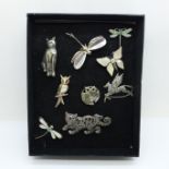 Nine silver brooches, cats, owls, etc.