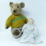 A 1950's Teddy bear and a hand painted bisque doll
