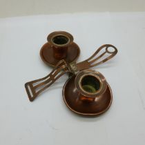 An Arts and Crafts copper candle holder