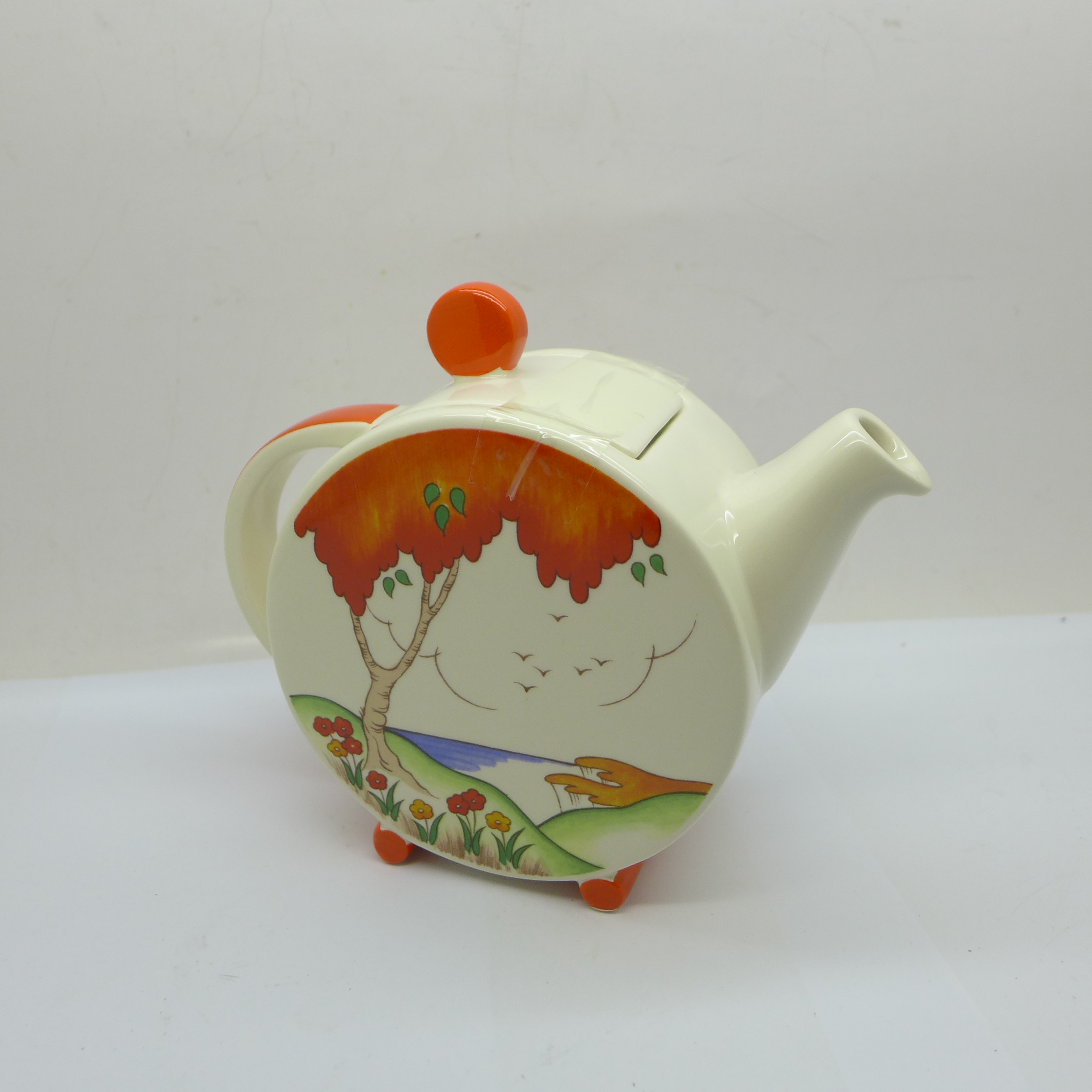 A Wedgwood limited edition Clarice Cliff teapot in the Orange Taormina design, number 73 of 100, H: