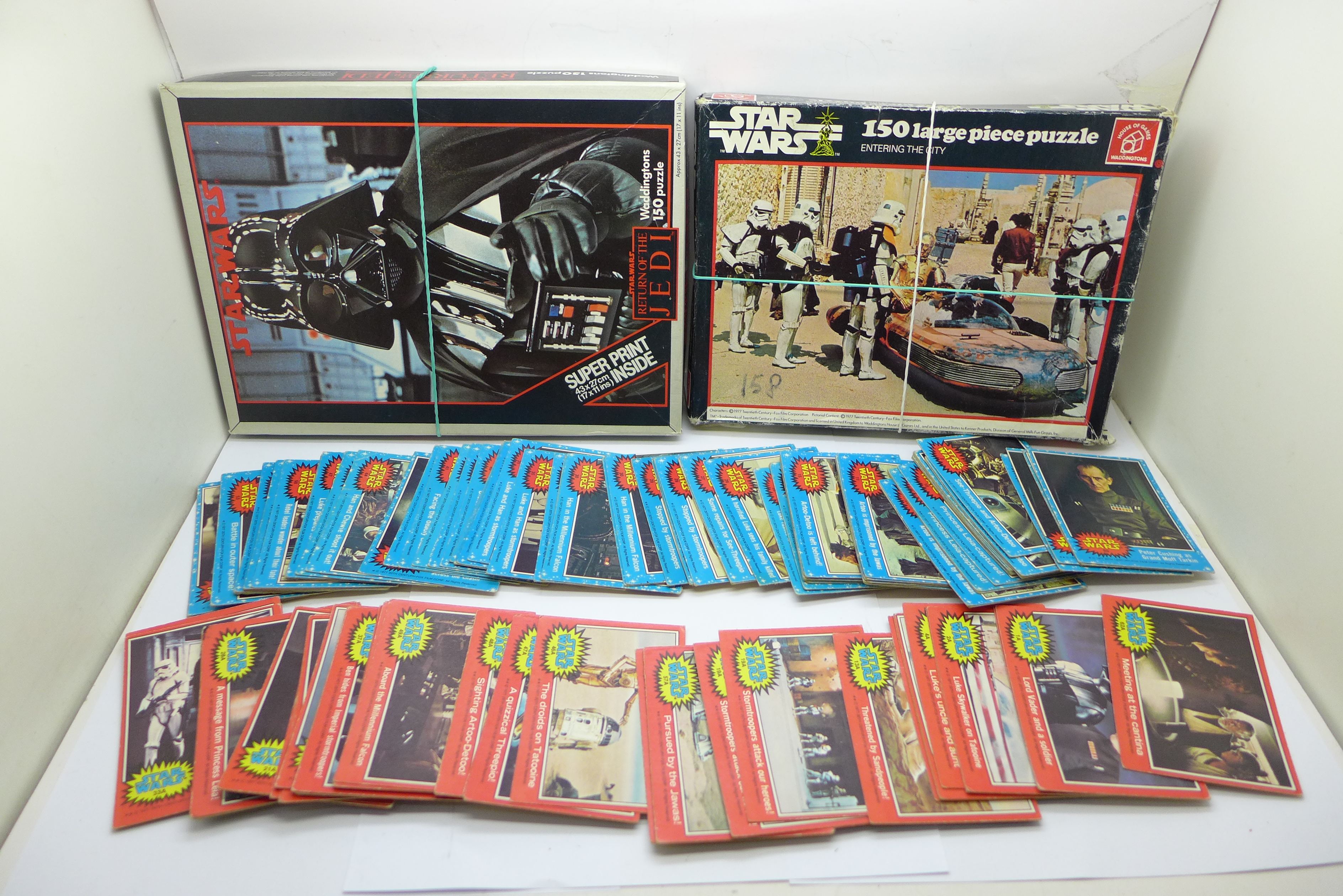 Two Star Wars themed jigsaw puzzles and various 1977 picture cards