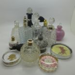 A collection of scent bottles and three paperweights