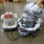 Two robots; a Tomy Omni Jr. and remote control Simba