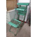 A set of four folding garden chairs