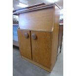 A teak cocktail cabinet