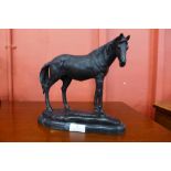 A bronze figure of a horse, on black marble plinth