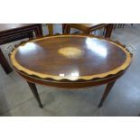 A George III style inlaid mahogany oval tray table