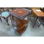 An Edward VII style inlaid mahogany revolving bookcase