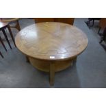 A Nathan teak circular coffee table